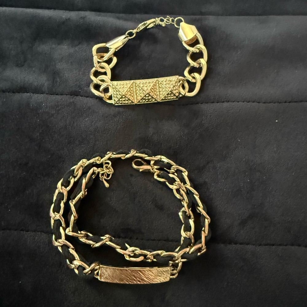 TWO fashion bracelets - gold and gold with black